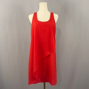 Turn heads with this vibrant red sleeveless dress! Elegant asymmetrical overlay